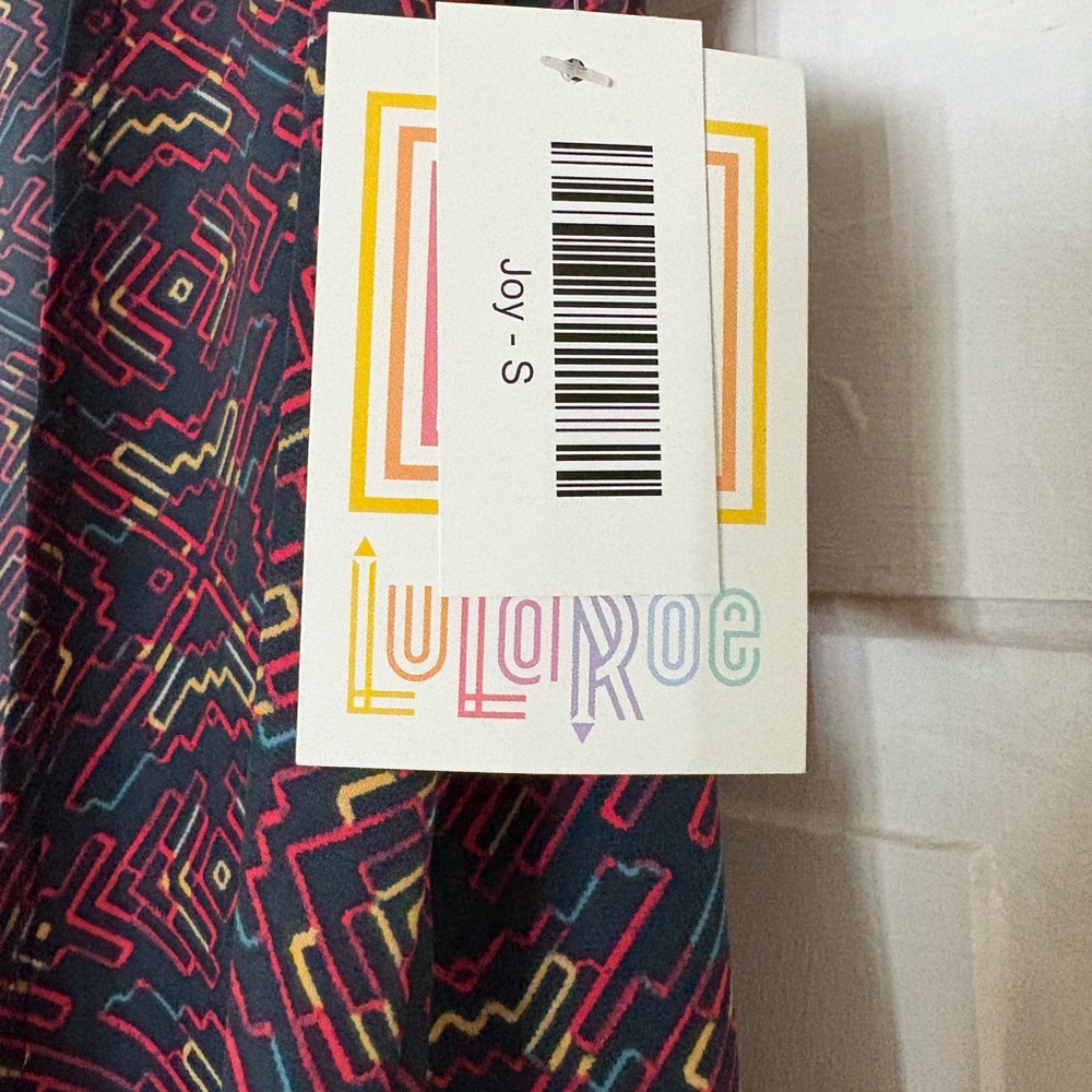LuLaRoe Geometric Patterned sleeveless duster Top - Pink and Yellow Accents